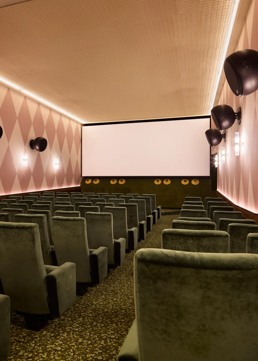 L'Audito auditorium, screen and acoustic treatment, ivy green on harlequin diamonds, perforated ceiling.
